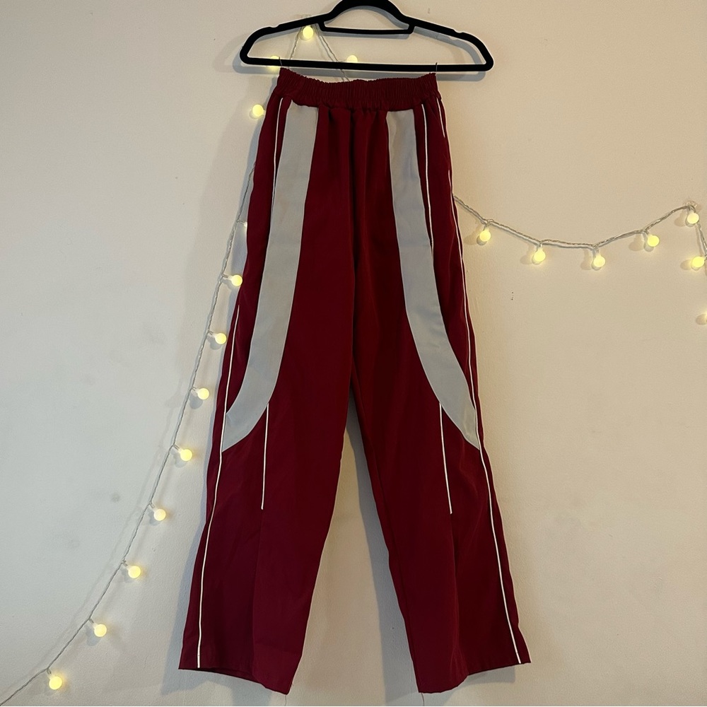Red and white windbreaker pants